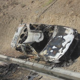 آتش نشانی نیشابور - مرگ راننده پژو در میان آتش